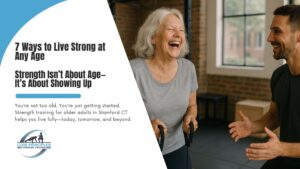 Older woman smiling confidently during strength training session at Core Principles Personal Training gym in Stamford CT