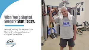 Older man smiling and flexing after a safe strength training over 50 in Stamford CT session at Core Principles Personal Training.