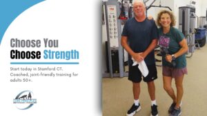 Two adults 50+ smiling after a coached strength session at Core Principles in Stamford CT