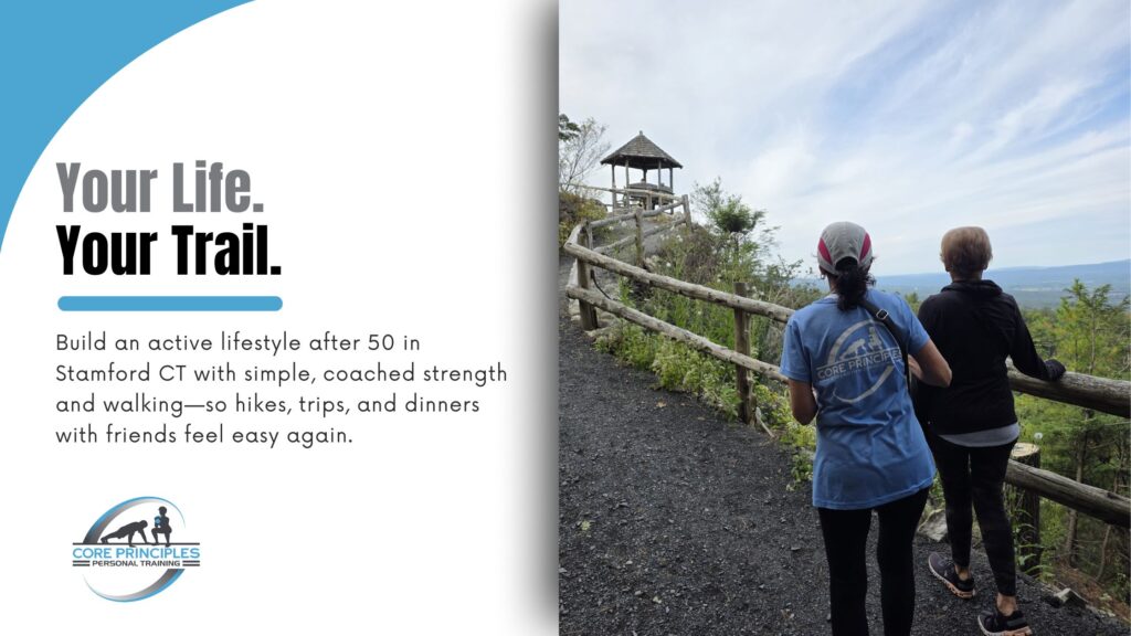 Two women in their 50s+ walking a scenic hill trail, building an active lifestyle after 50 in Stamford CT with Core Principles.
