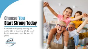 Grandparents lifting their grandchildren’s arms and smiling. Strong, active grandparents in Stamford CT